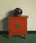 Chinese pot on red chest